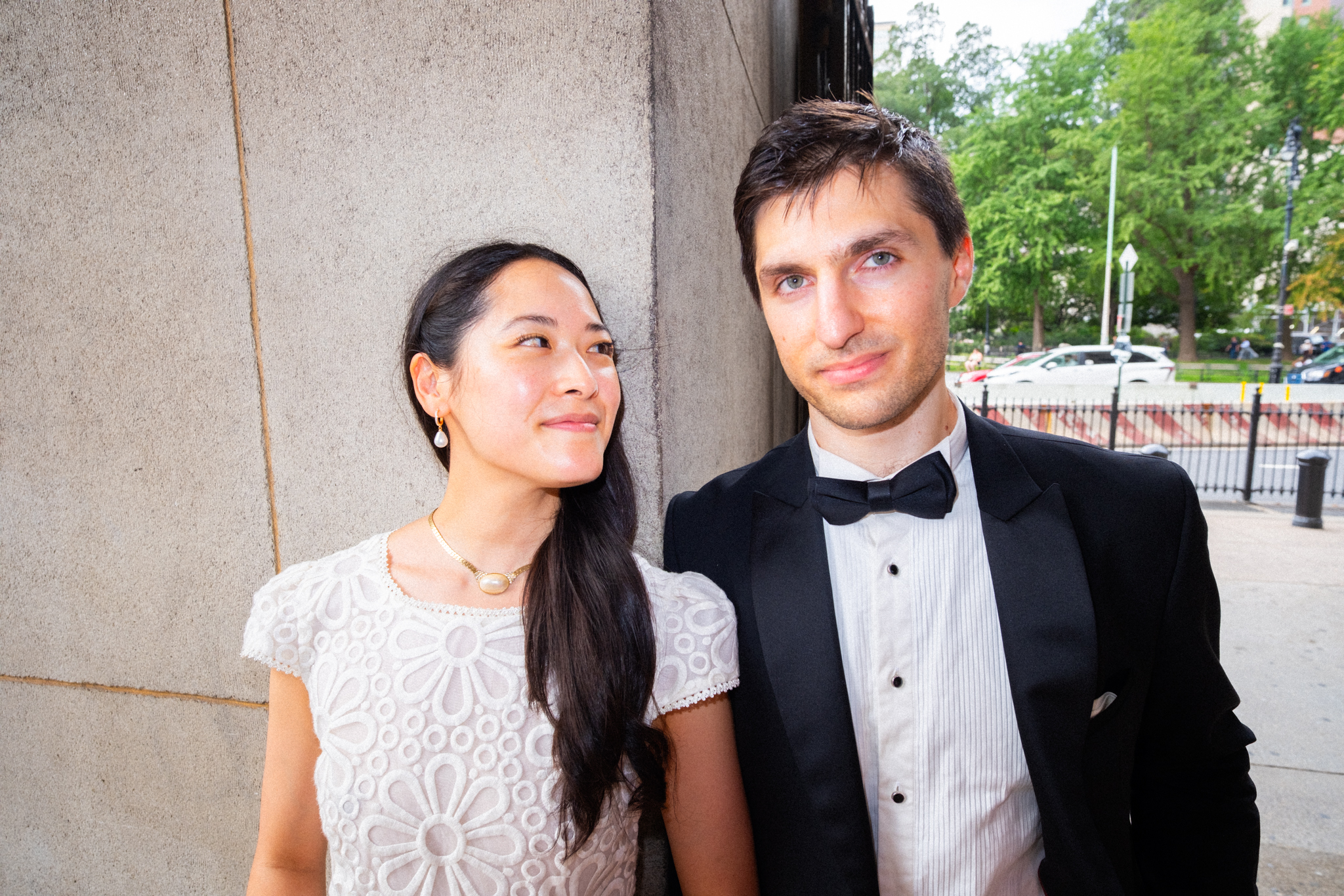 Joyce and Alex standing together outside the courthouse in direct flash